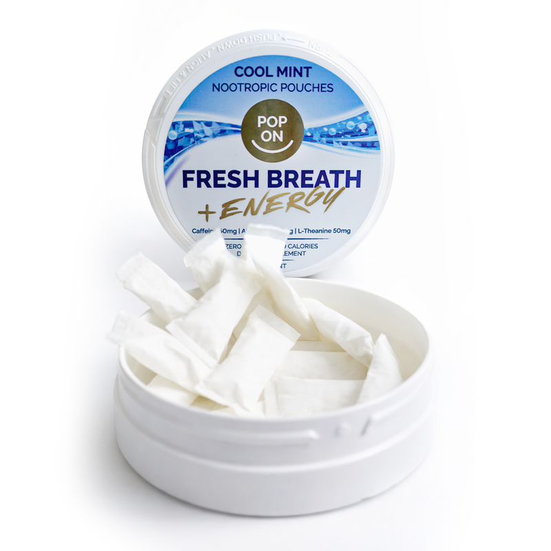 Container of 'Fresh Breath + Energy' nootropic pouches with a visible label on a white background